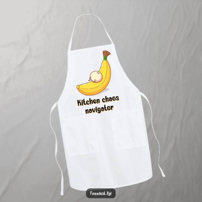 Funny apron design of a small round character with legs gleefully rolling down a huge banana peel, a humorous cooking accessory.