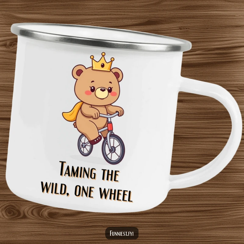 Funny bear camping mug, a crowned bear precariously balancing on a unicycle, perfect for outdoor brews.