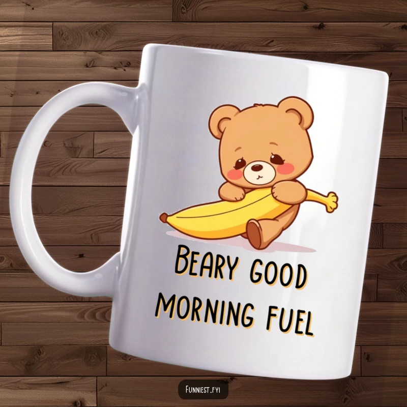 Funny clumsy teddy bear character comically tripping over a bright yellow runaway banana on this mug.