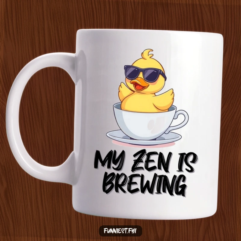 Funny rubber duck wearing sunglasses floating upside down in a teacup, looking surprisingly relaxed. A humorous gift for tea enthusiasts.