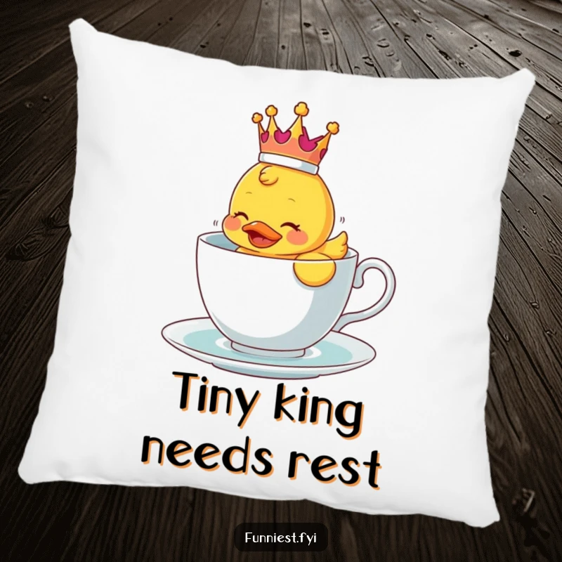Funny decorative pillow showing a crowned rubber ducky comically struggling in a teacup, soft and witty.