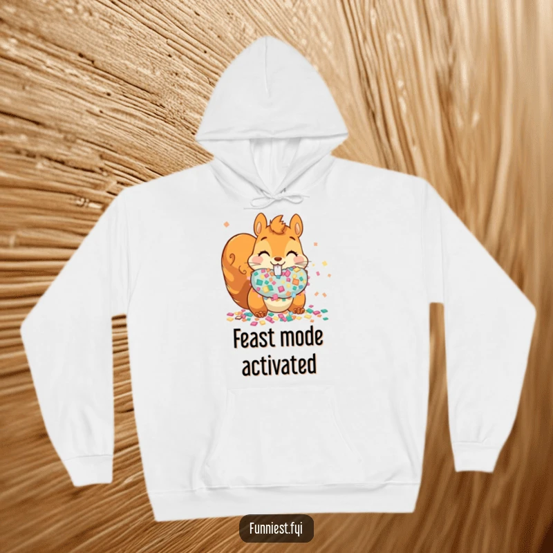 Funny mischievous squirrel stuffing cheeks with confetti on a hoodie, offering warmth and party vibes.