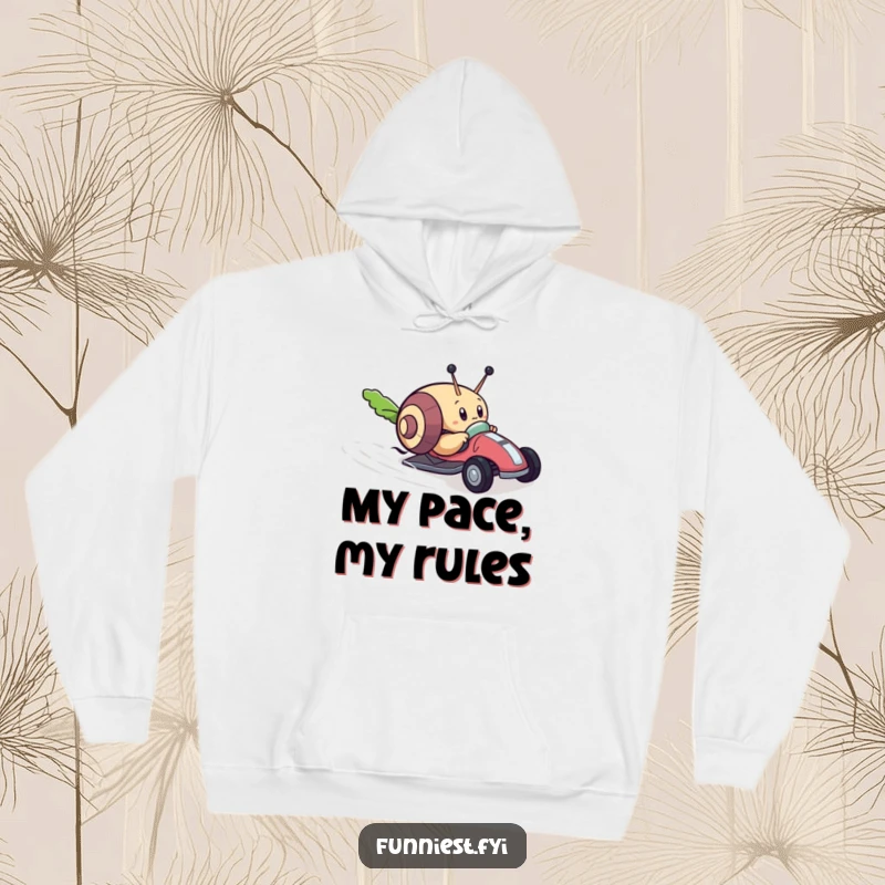 Funny hoodie with a determined snail character racing a tiny toy car towards a lettuce leaf, embodying humorous ambition and speed.
