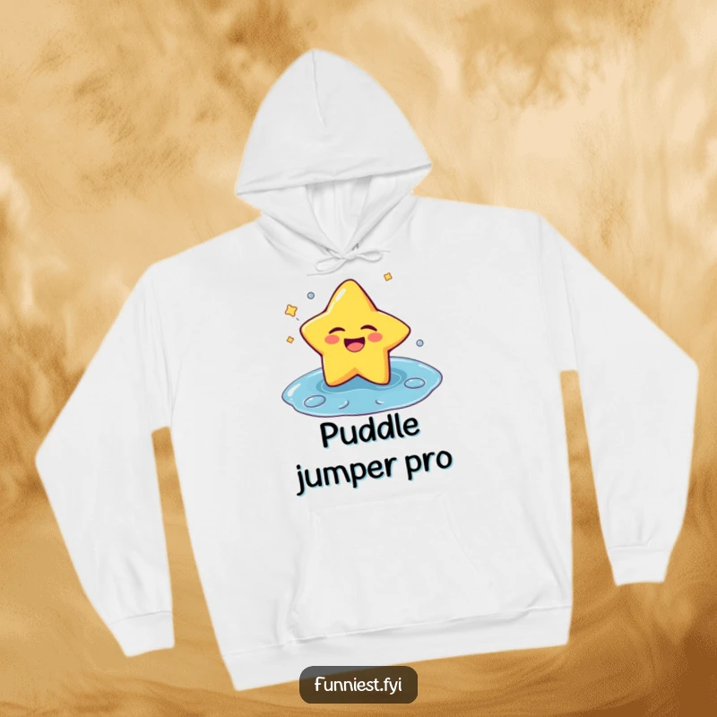 Funny, cozy hoodie featuring a laughing star character winking and splashing into a puddle, a symbol of embracing fun.