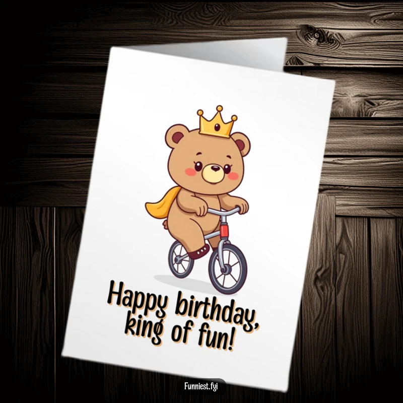 Funny Free Printable Birthday Card: A bear wearing a tiny crown precariously balances on a unicycle, a humorous downloadable greeting.