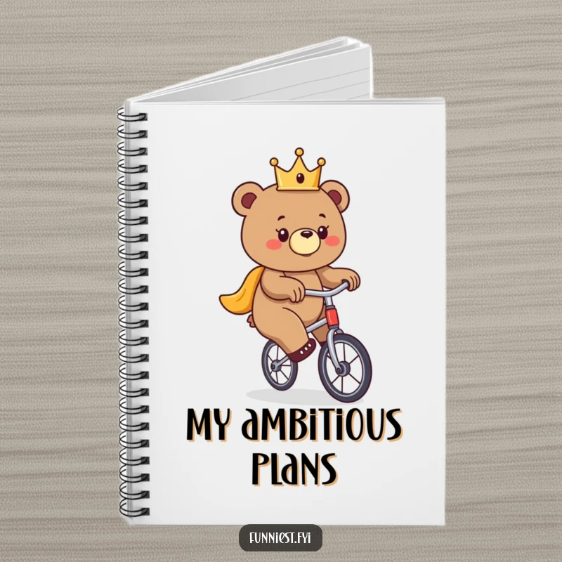 Funny bear notebook, a bear wearing a crown hilariously attempts to ride a unicycle on the cover.