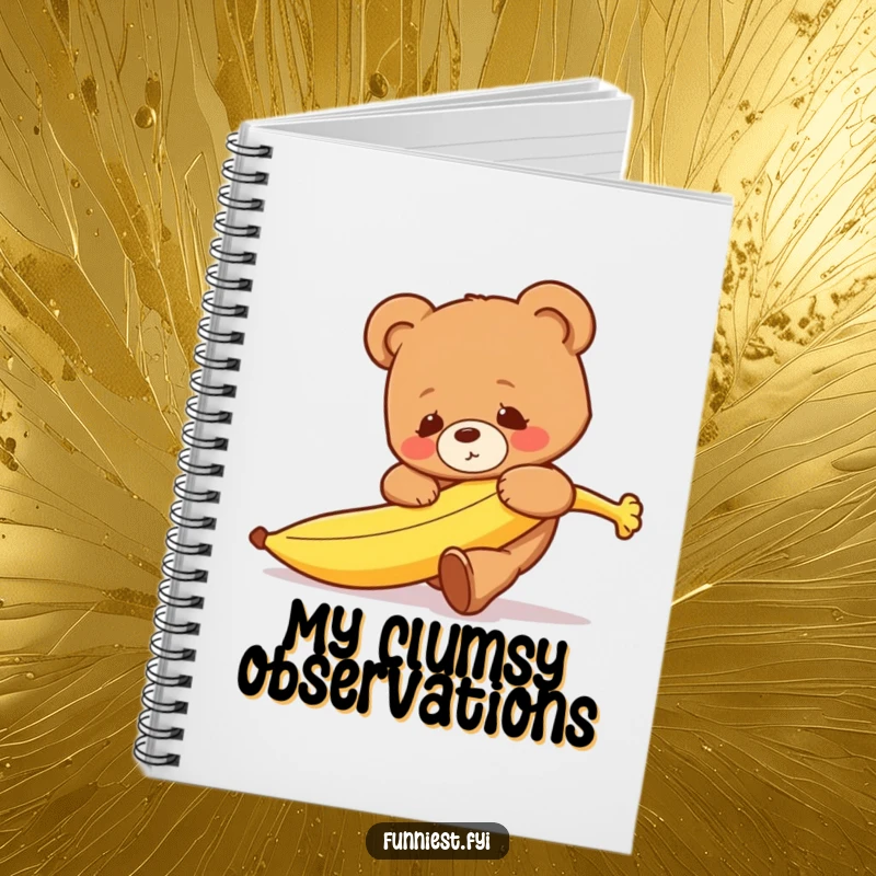 A notebook with a cover featuring a funny clumsy teddy bear tripping over a runaway banana, inspiring fun note-taking.