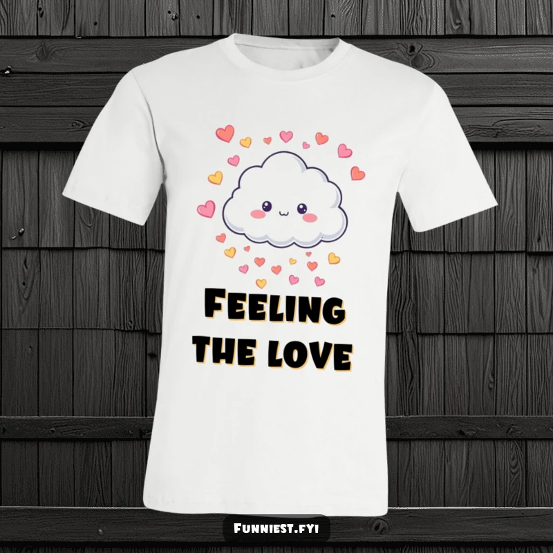 Funny T-Shirt with a smiling fluffy cloud character joyfully raining tiny colorful hearts, a symbol of love and happiness.