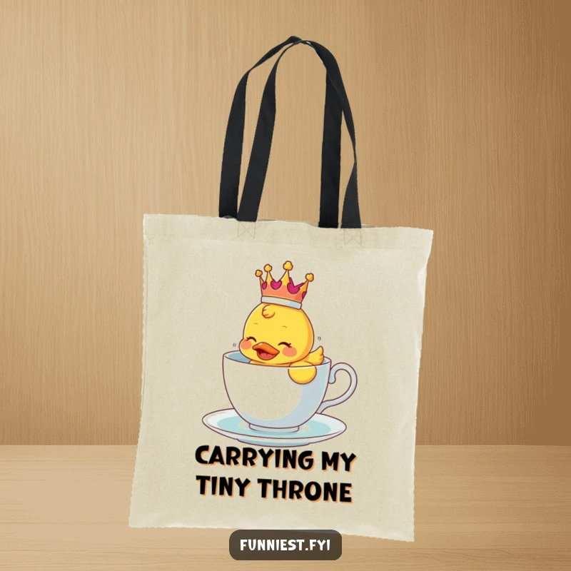 Funny tote bag featuring a crowned rubber ducky comically floating in a teacup, practical humor.