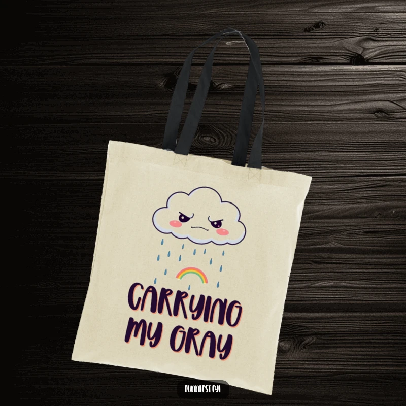 Funny tote bag depicting a grumpy cloud raining a single, tiny rainbow, a humorous and practical accessory.
